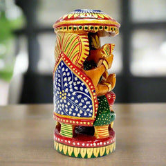 Vastu compliant wooden Ganesha idol with fine craftsmanship and auspicious umbrella design