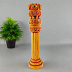 A handcrafted wooden Ashoka Pillar with four lions standing back to back, representing the Lion Capital of India.