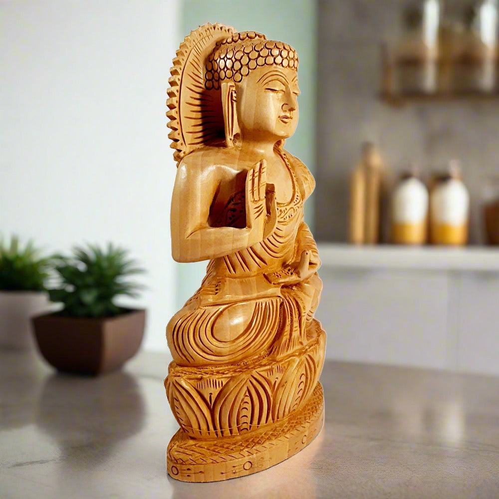 Seated wooden Buddha statue side view, fine wood carving details.