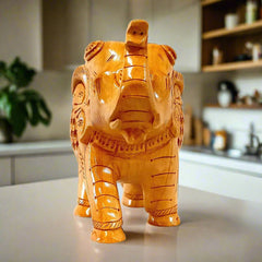 A very beautiful wooden carved elephant with a baby elephant inside, a perfect gift for any occasion.
