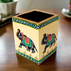 A wooden desk organizer that can hold pens and markers, a perfect gift for employees.