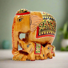 A wooden elephant family showpiece with hand painting, a beautiful addition to any home.