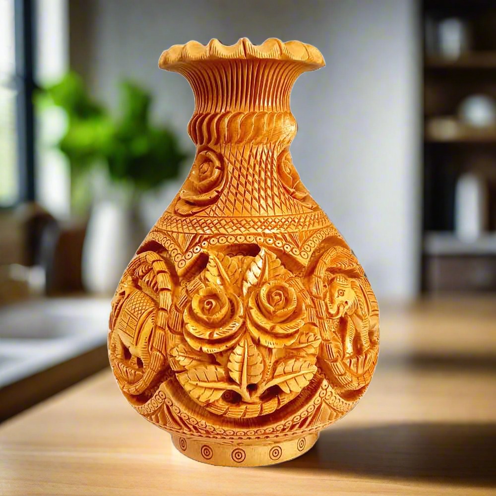 Handcrafted wooden flower vase with elephant floral carvings front view.