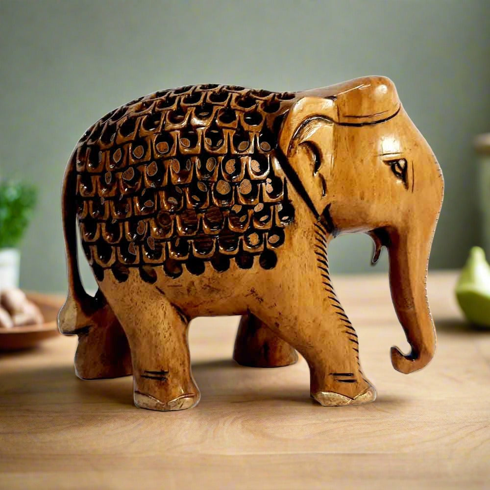 Back showing master artisan undercut holes in lattice elephant statue.