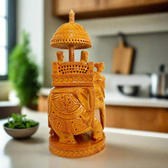A royal wooden elephant with a king riding on a throne, a perfect showpiece for home interior decoration.