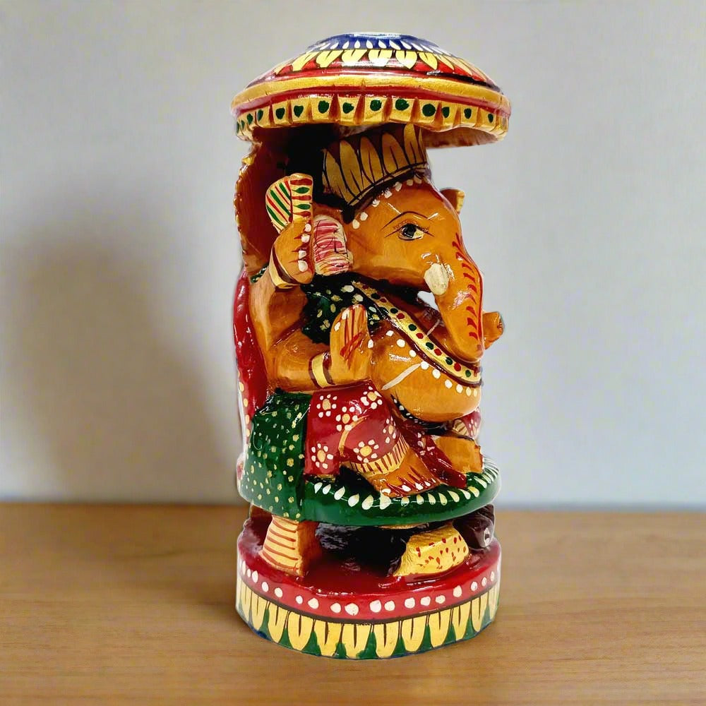 Round wooden Ganesha statue with intricate hand painting, ideal for home and office decor