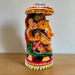 Round wooden Ganesha statue with intricate hand painting, ideal for home and office decor