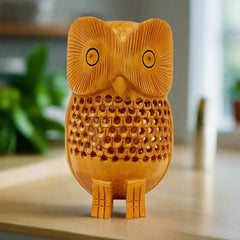 A beautiful wooden owl statue with an intricate undercut (lattice) design, made from a single piece of wood.