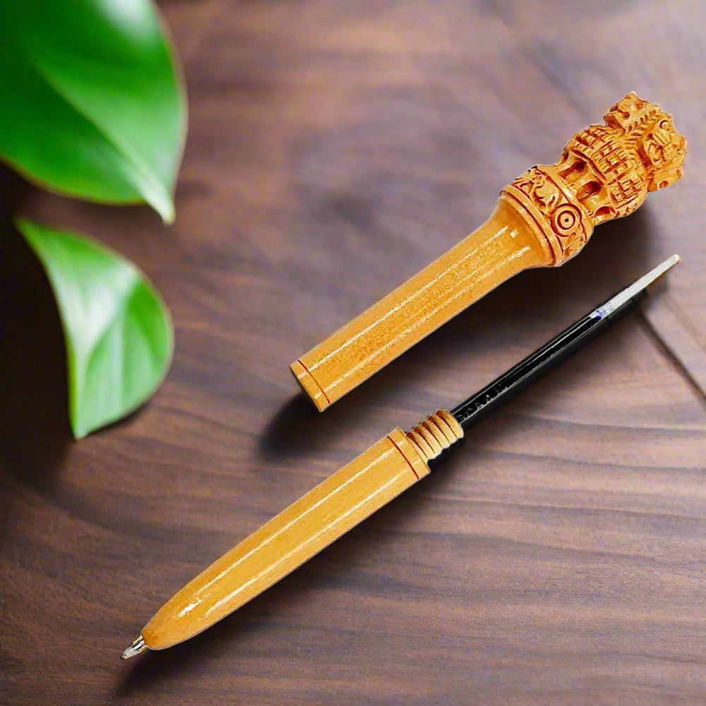 Fine quality wooden pen with Ashoka emblem on top, handcrafted and includes blue refill for smooth writing.