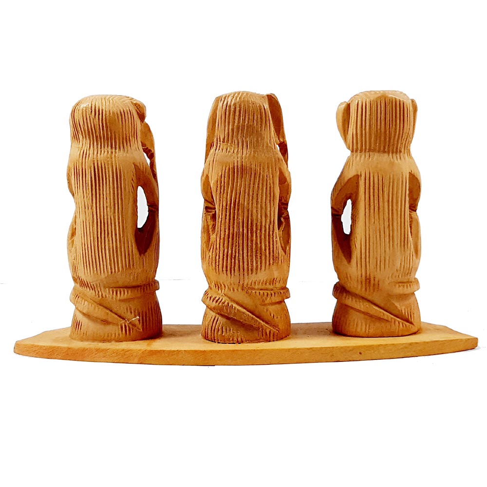 A wooden showpiece of the "see no evil, hear no evil, speak no evil" monkeys, a guiding gift for children.