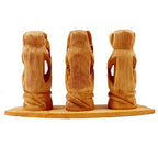A wooden showpiece of the "see no evil, hear no evil, speak no evil" monkeys, a guiding gift for children.