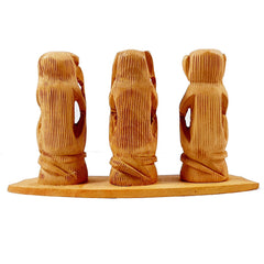 A wooden showpiece of the "see no evil, hear no evil, speak no evil" monkeys, a guiding gift for children.