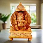 Hand carved wooden sitting Ganesh idol on arch chowki for home temple and decor gifts.