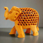 Wooden tusks and craftsmanship detail on lucky elephant home decor showpiece