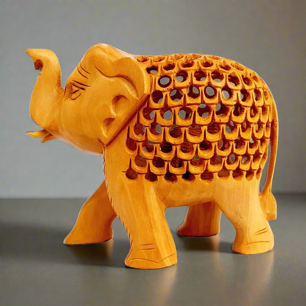 Wooden tusks and craftsmanship detail on lucky elephant home decor showpiece