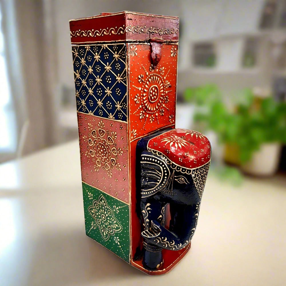 Wooden wine bottle box with embossed hand-painted elephant design on the front and traditional artwork on all sides.